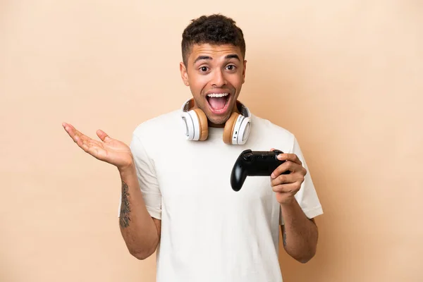 Young Brazilian Man Playing Video Game Controller Isolated Beige Background —  Fotos de Stock