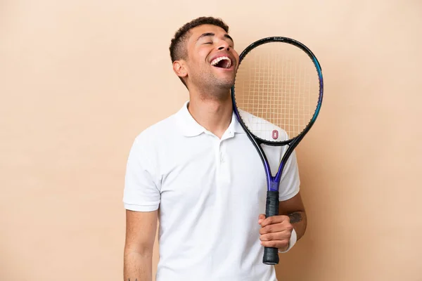 Young Brazilian Handsome Man Playing Tennis Isolated Beige Background Laughing — Stockfoto