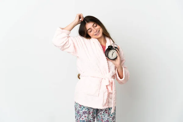 Young Caucasian Woman Isolated White Background Pajamas Holding Clock Doing — Stockfoto