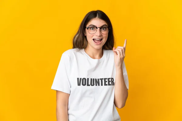Young Volunteer Woman Isolated Yellow Background Intending Realizes Solution While — Foto de Stock