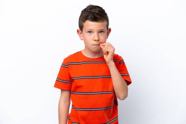 Little boy isolated on white background showing a sign of silence gesture