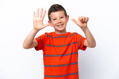 Little boy isolated on white background counting six with fingers