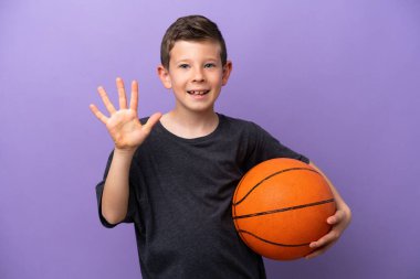 Little boy playing basketball isolated on purple background counting five with fingers