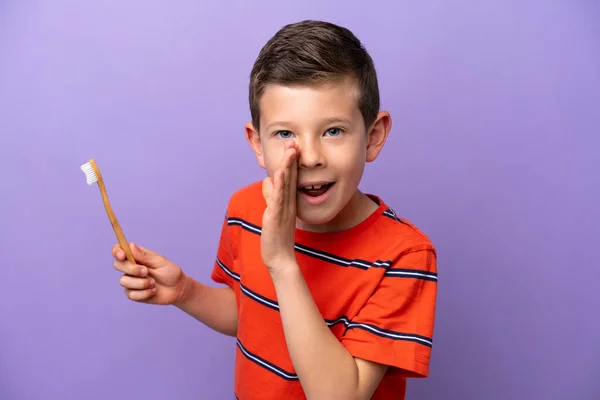 Little Boy Brushing Teeth Isolated Purple Background Whispering Something — Foto Stock