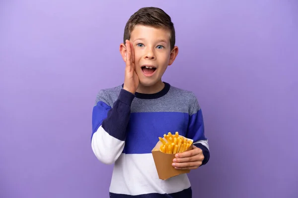 Little Boy Holding Fried Chips Isolated Purple Background Surprise Shocked — Stockfoto