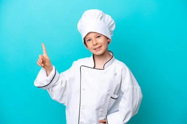 Little Chef Boy Isolated Blue Background Showing Lifting Finger Sign — Foto Stock