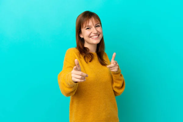 Redhead Girl Isolated Blue Background Pointing Front Smiling — Foto Stock