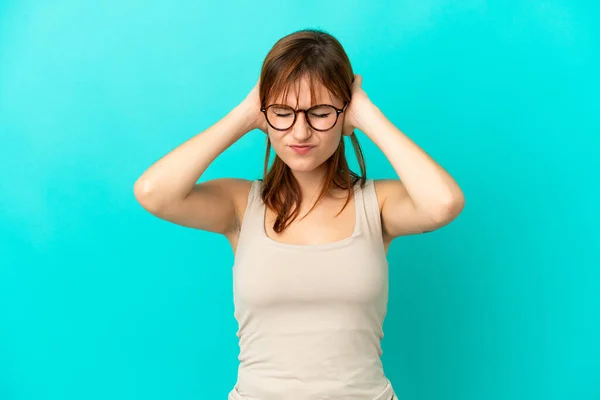 Redhead Girl Isolated Blue Background Frustrated Covering Ears — Foto de Stock