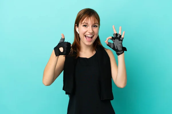 Redhead Sport Girl Isolated Blue Background Showing Sign Thumb Gesture — Zdjęcie stockowe