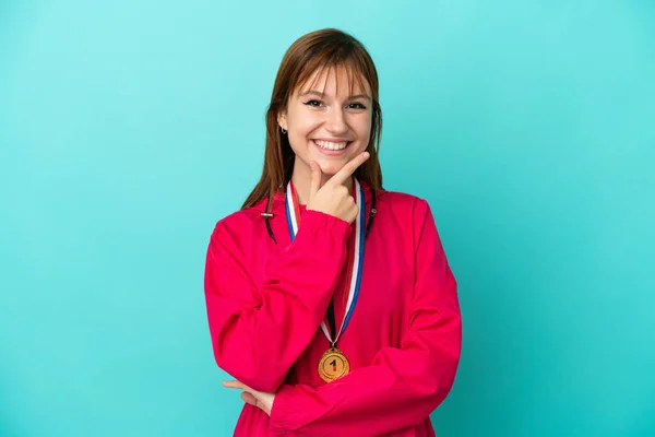 Redhead Girl Medals Isolated Blue Background Smiling — Zdjęcie stockowe