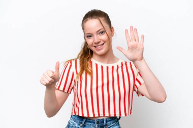 Young caucasian girl isolated on white background counting six with fingers