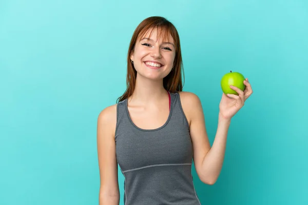 Redhead Girl Isolated Blue Background Apple Happy — Stock Fotó