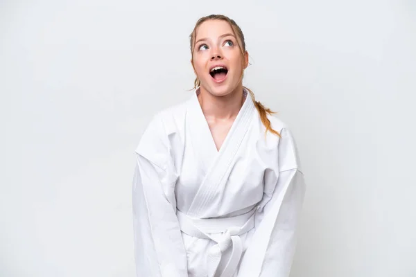 Young Caucasian Girl Doing Karate Isolated White Background Looking Surprised — 图库照片