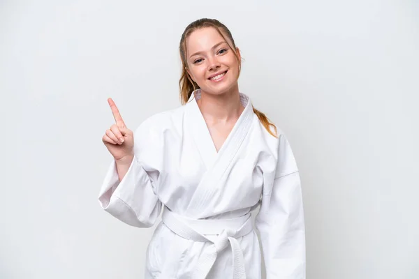 Young Caucasian Girl Doing Karate Isolated White Background Showing Lifting — ストック写真