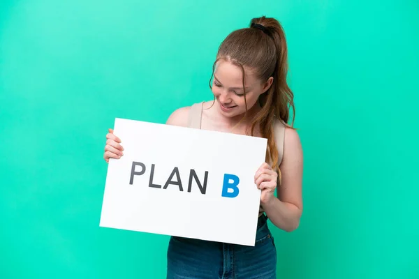 Young Caucasian Woman Isolated Green Background Holding Placard Message Plan — Stockfoto