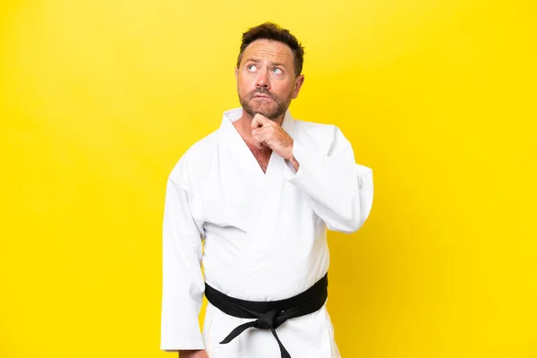 Middle Age Caucasian Man Doing Karate Isolated Yellow Background Looking — Foto de Stock