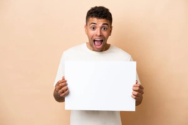 Young Brazilian Man Isolated Beige Background Holding Empty Placard Happy — 图库照片