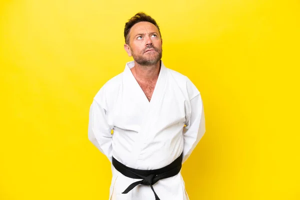 Middle Age Caucasian Man Doing Karate Isolated Yellow Background Looking — Foto Stock