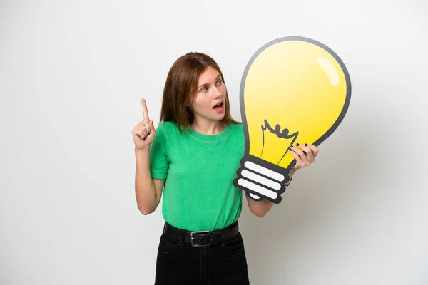 Young English Woman Isolated White Background Holding Bulb Icon Thinking — Stok fotoğraf