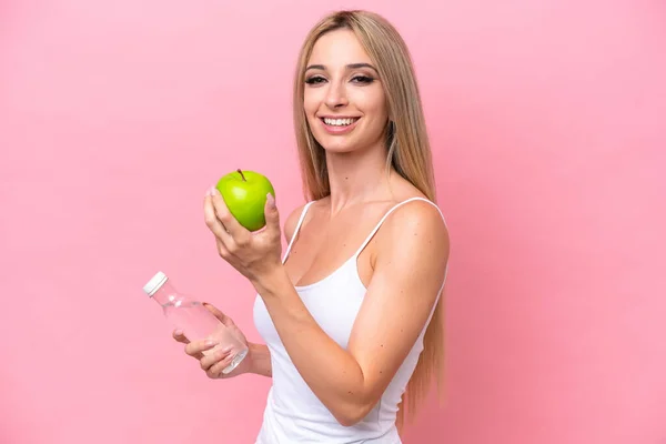 Pretty Blonde Woman Isolated Pink Background Apple Bottle Water — Stockfoto