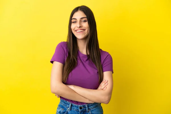 Young Caucasian Woman Isolated Yellow Background Keeping Arms Crossed Frontal — Stock Photo, Image