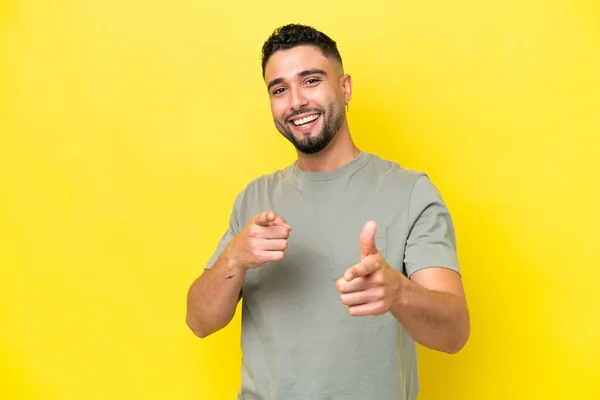 Young Arab Handsome Man Isolated Yellow Background Surprised Pointing Front — 스톡 사진