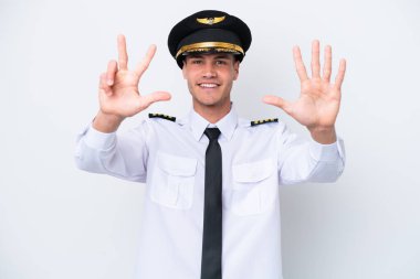 Airplane caucasian pilot isolated on white background counting eight with fingers