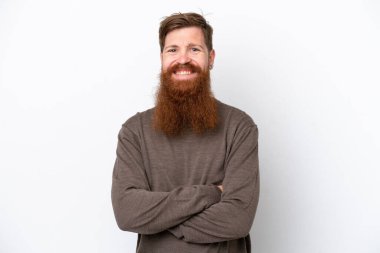 Beyaz arka planda sakallı kızıl saçlı adam kollarını ön cephede çapraz tutuyor.