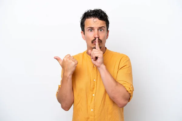 Joven Con Bigote Aislado Sobre Fondo Blanco Apuntando Hacia Lado —  Fotos de Stock