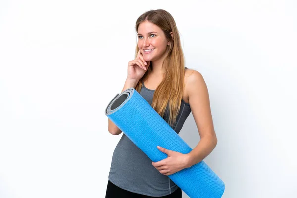 Young Sport Woman Going Yoga Classes While Holding Mat Thinking — Stockfoto