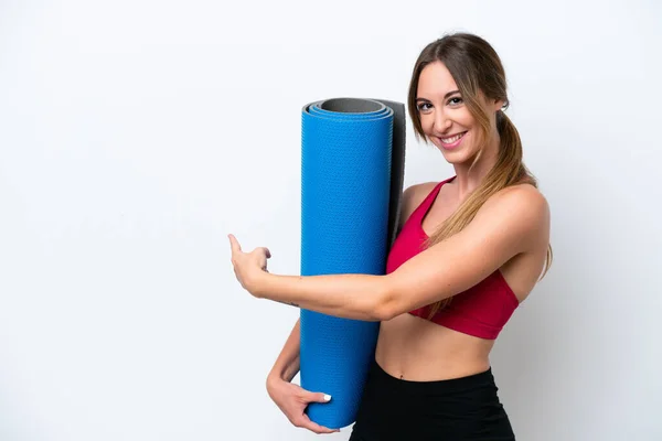 Young Sport Woman Going Yoga Classes While Holding Mat Isolated — Stock Fotó