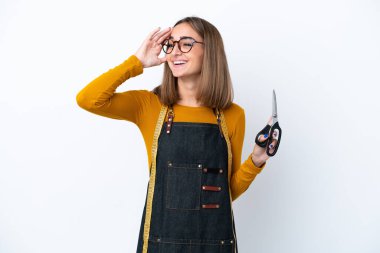 Young caucasian sewing box woman isolated on white background smiling a lot