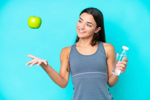 Young Caucasian Woman Isolated Blue Background Apple Bottle Water — Stock Photo, Image