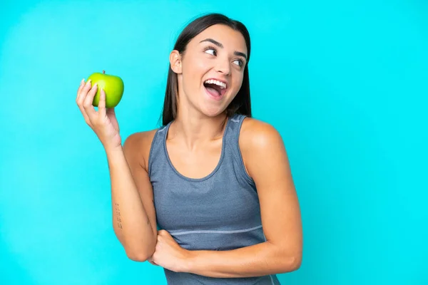 Young Caucasian Woman Isolated Blue Background Apple Happy — Stock Photo, Image