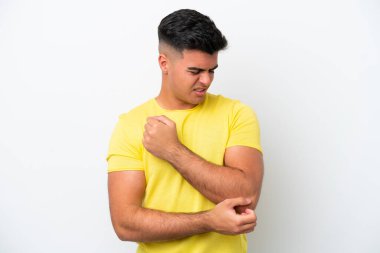 Young caucasian handsome man isolated on white background with pain in elbow
