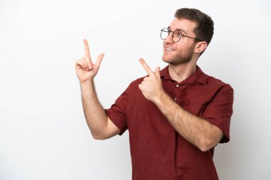 Young caucasian man isolated on white background pointing with the index finger a great idea