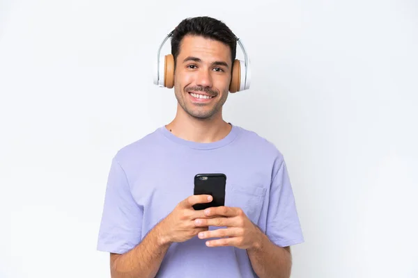 Giovane Bell Uomo Sfondo Bianco Isolato Ascoltare Musica Con Cellulare — Foto Stock