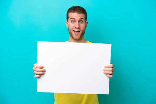 Young Caucasian Man Isolated Blue Background Holding Empty Placard Happy — Stockfoto