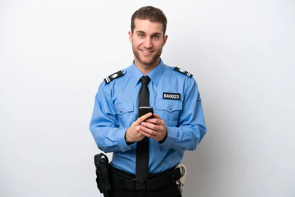 Young Police Caucasian Man Isolated White Background Sending Message Mobile — Stok fotoğraf
