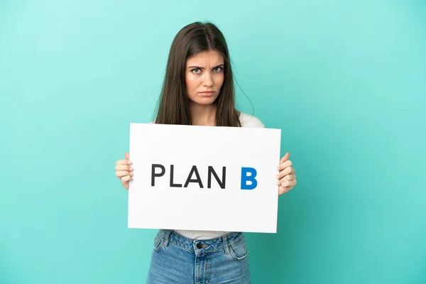 Young Caucasian Woman Isolated Blue Background Holding Placard Message Plan — Stock Photo, Image