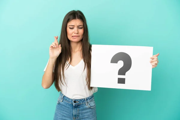 Young Caucasian Woman Isolated Blue Background Holding Placard Question Mark — Stock Photo, Image