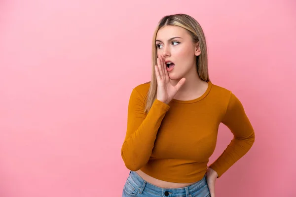 Young Caucasian Woman Isolated Pink Background Whispering Something Surprise Gesture — Stock Photo, Image