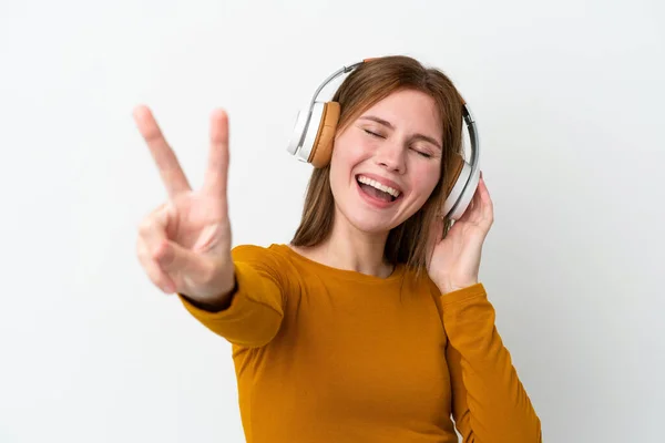 Young English Woman Isolated White Background Listening Music Singing — Stockfoto