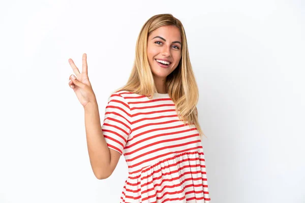 Loira Uruguaia Menina Isolada Fundo Branco Sorrindo Mostrando Sinal Vitória — Fotografia de Stock