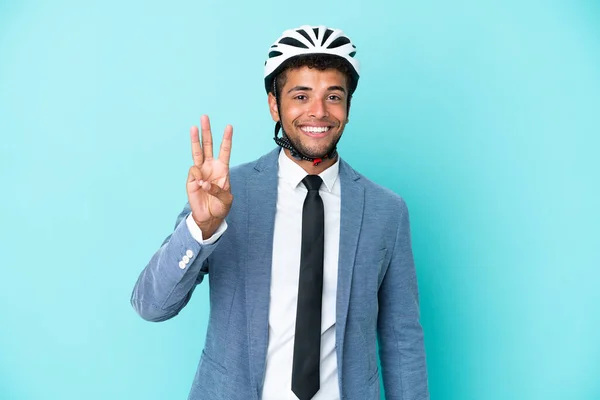 Junger Geschäftsmann Mit Fahrradhelm Auf Blauem Hintergrund Glücklich Und Zählt — Stockfoto