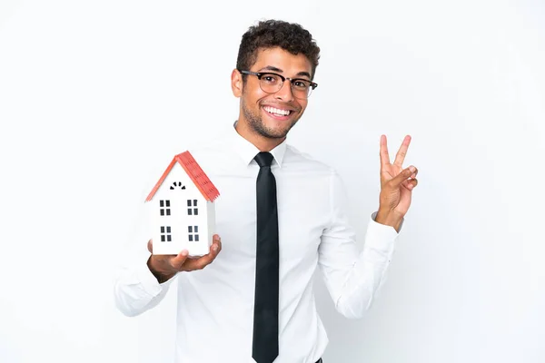 Young Business Brazilian Man Holding House Toy Isolated White Background — Stock Photo, Image