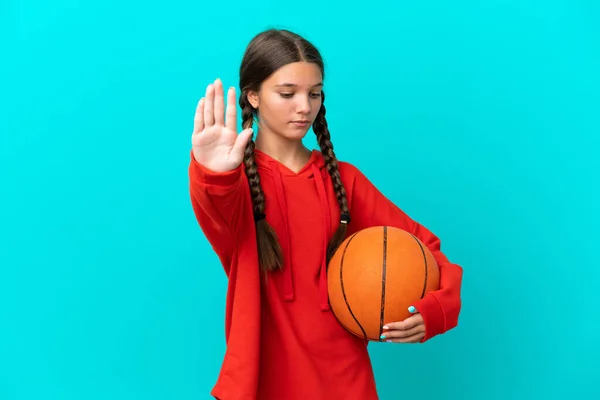 Little Caucasian Girl Playing Basketball Isolated Blue Background Making Stop — Stok Foto