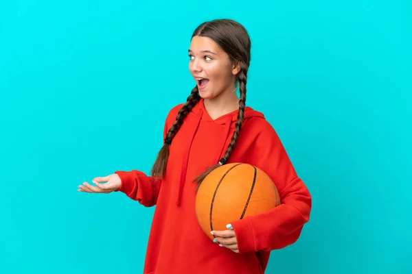 Little Caucasian Girl Playing Basketball Isolated Blue Background Surprise Expression — Foto Stock