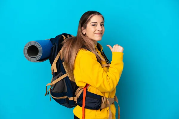 Young Mountaineer Woman Big Backpack Isolated Blue Background Proud Self — Stock Photo, Image