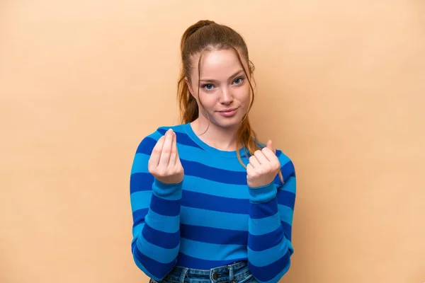 Young Caucasian Woman Isolated Beige Background Making Money Gesture Ruined — Stock Photo, Image